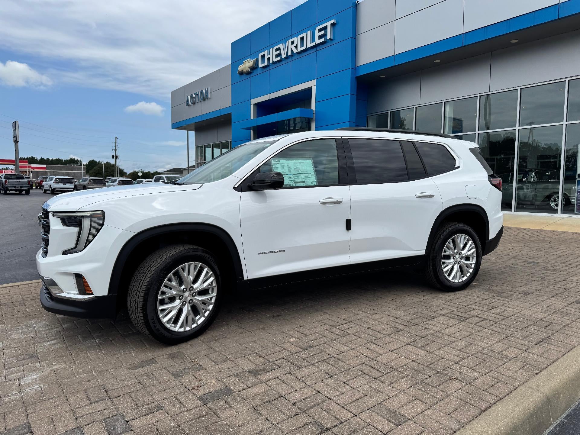 2026 GMC Acadia Elevation in Summit White — front three-quarter view