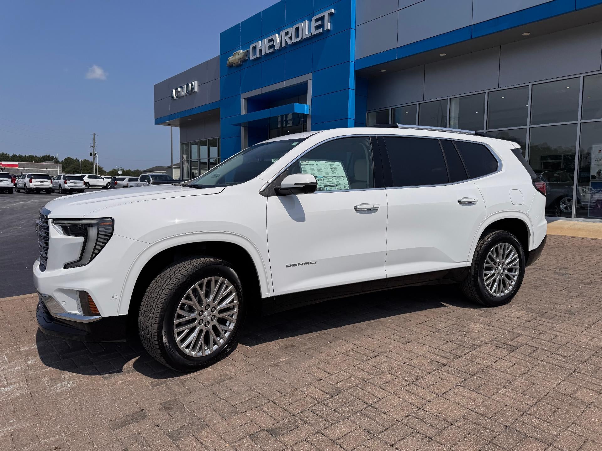 2026 GMC Acadia Denali in Summit White — front three-quarter view