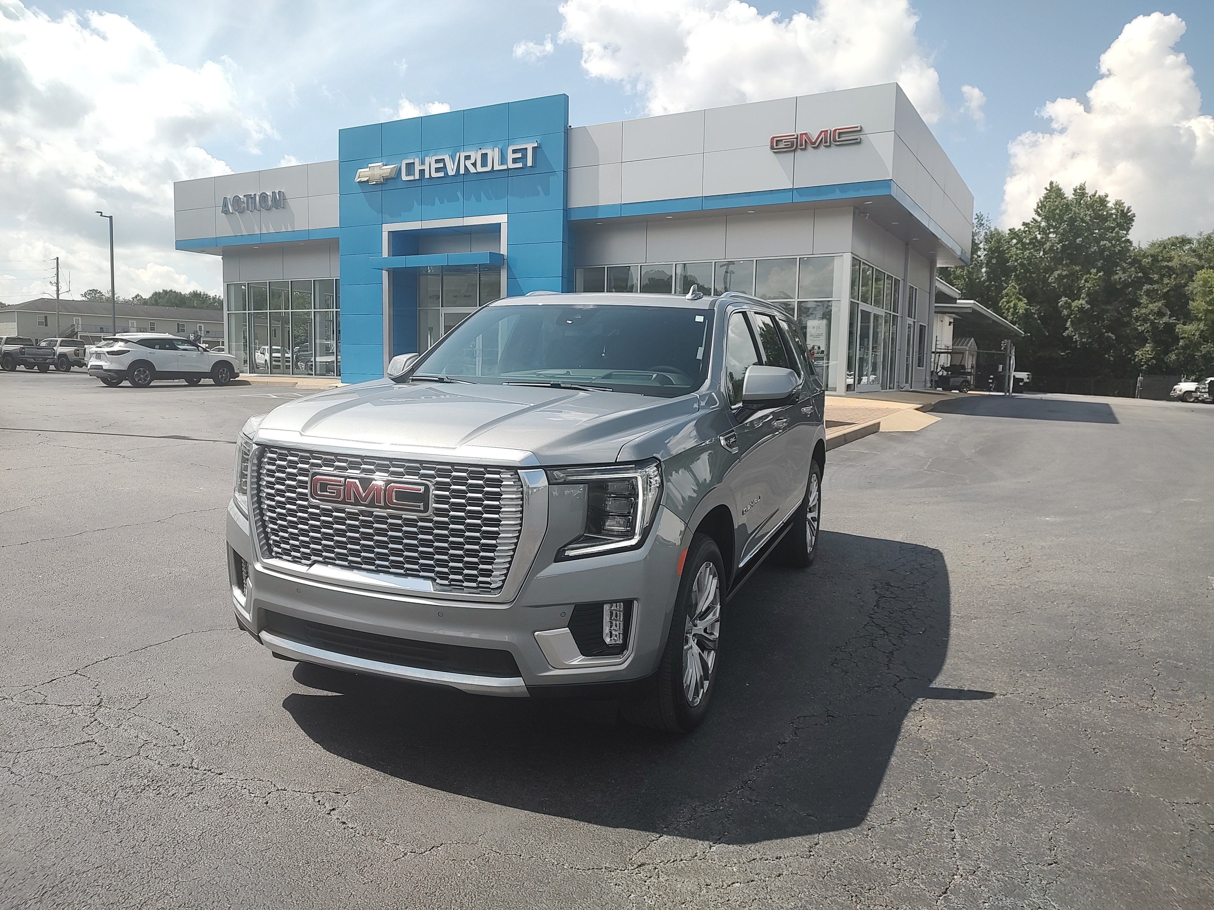 2024 GMC Yukon Denali in Sterling Metallic — front three-quarter view