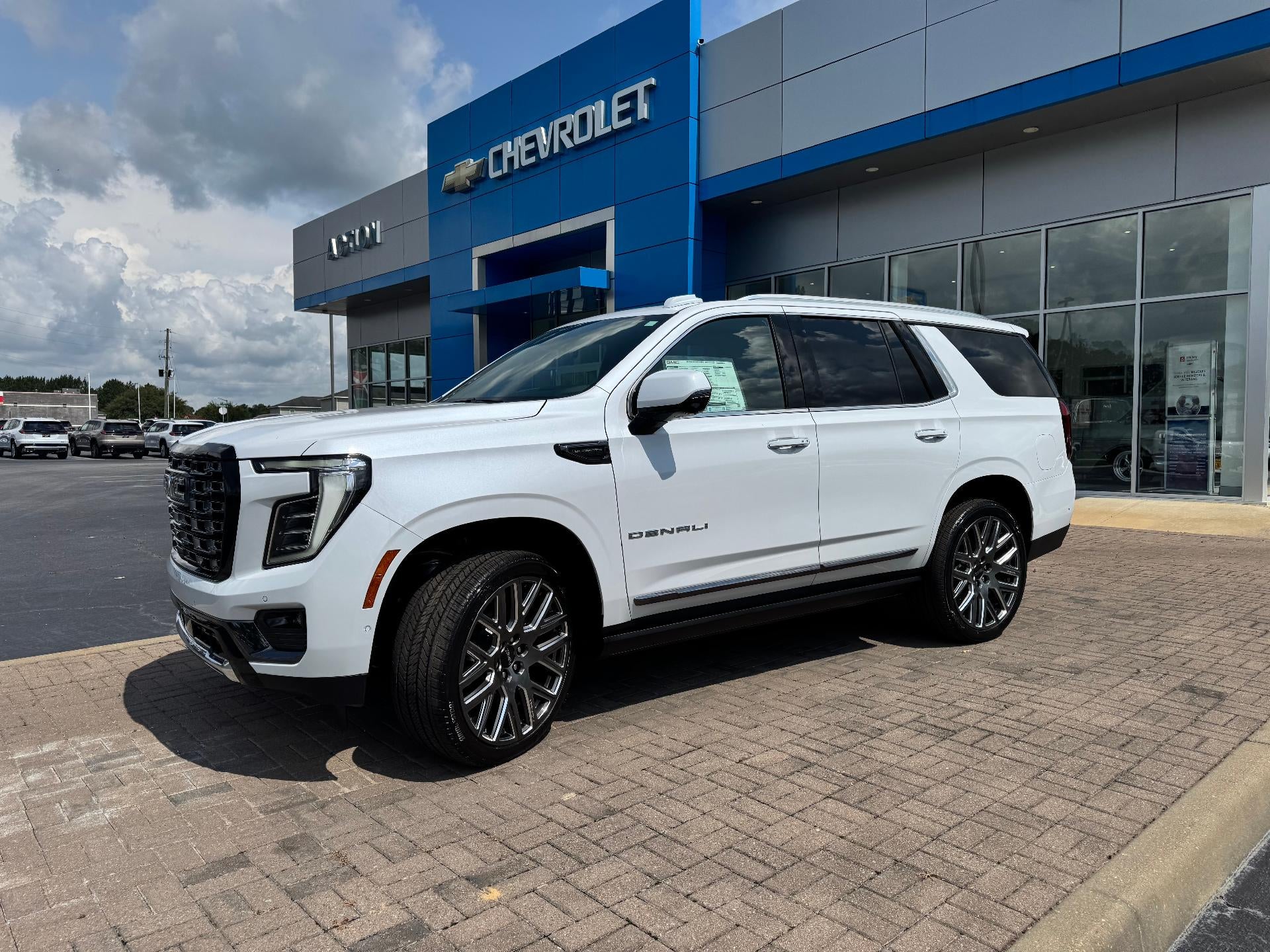 2026 GMC Yukon Denali Ultimate in Glacier White Tricoat — front three-quarter view