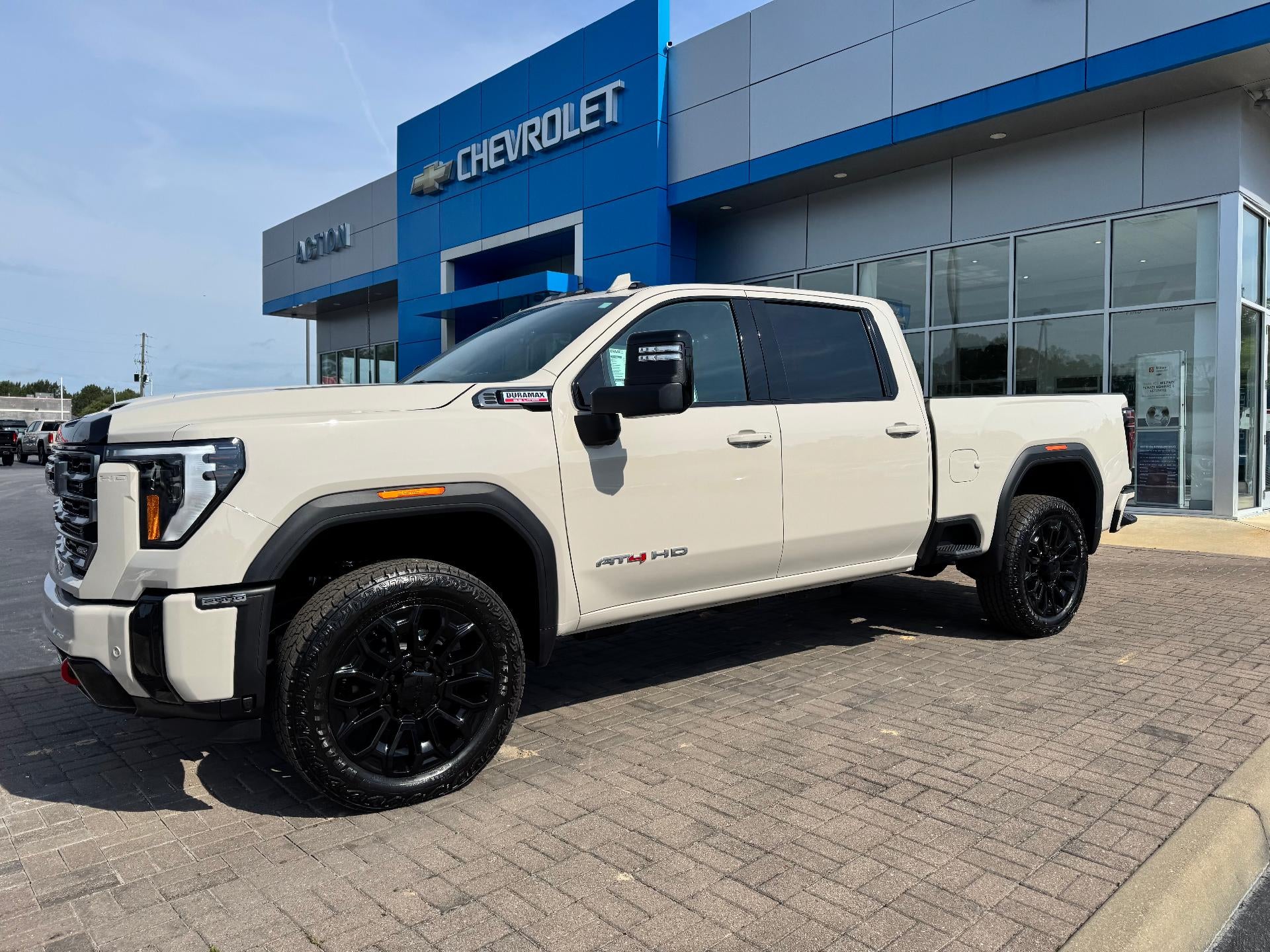 2026 GMC Sierra 2500 HD AT4 in Coastal Dune — front three-quarter view