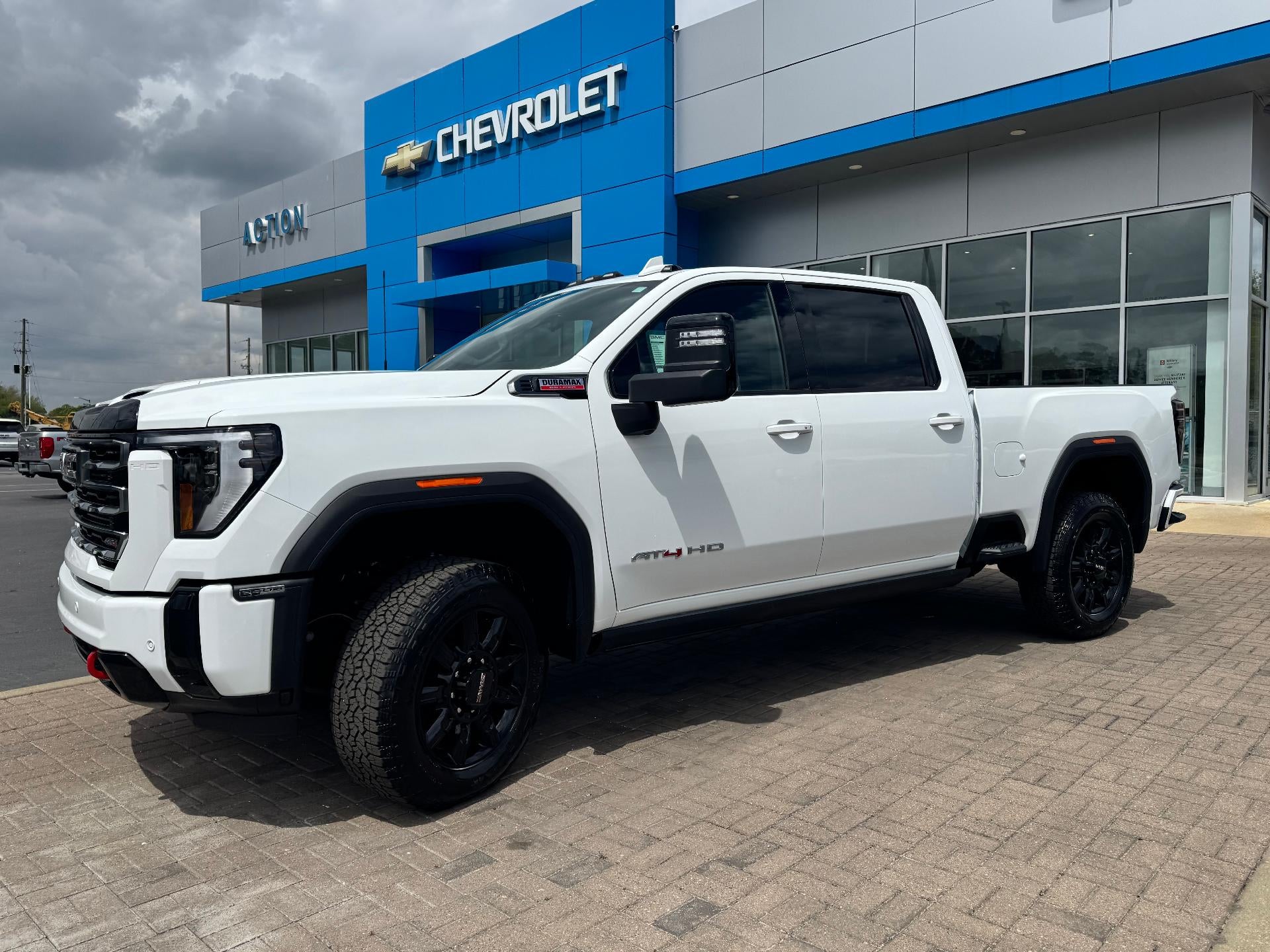 2026 GMC Sierra 2500 HD AT4 in Summit White — front three-quarter view