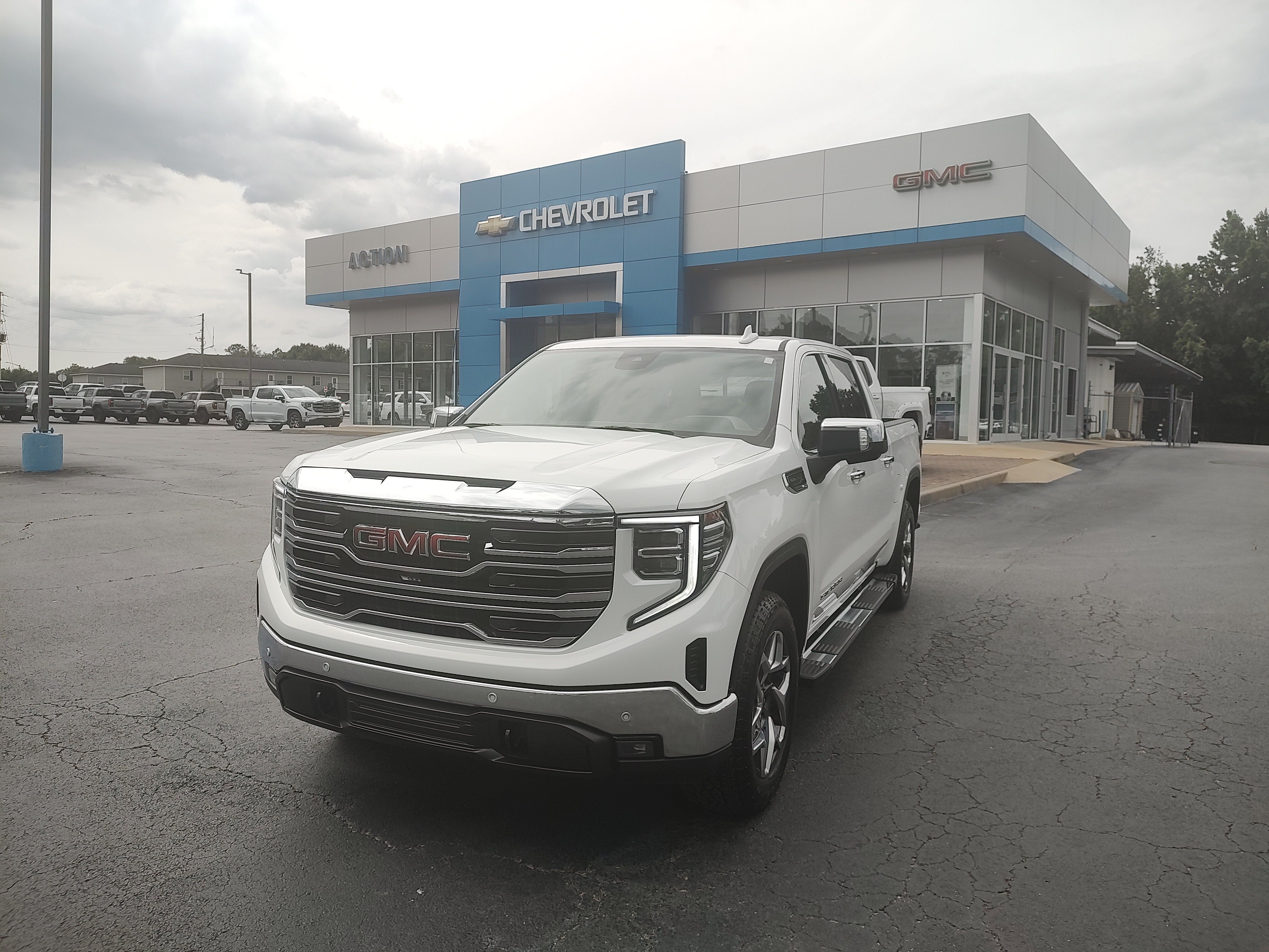2024 GMC Sierra 1500 SLT in Summit White — front three-quarter view