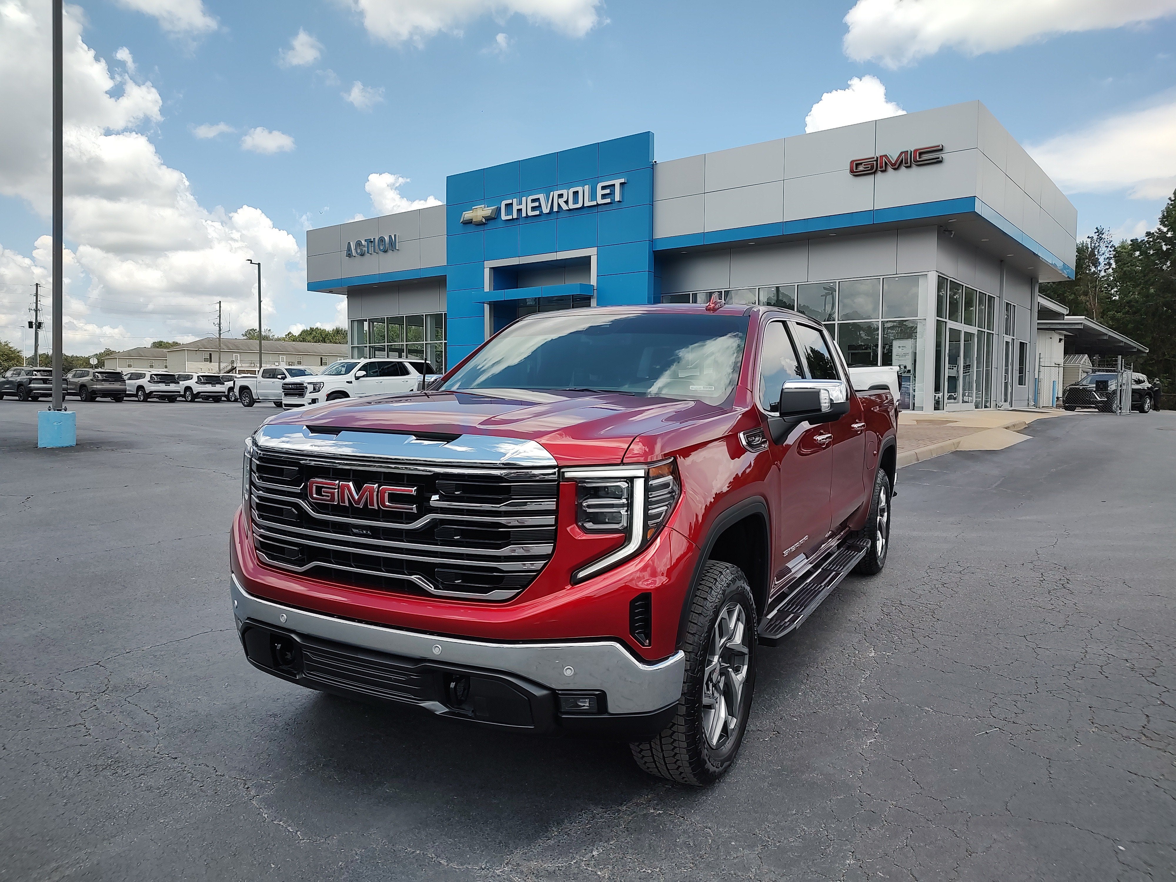 2025 GMC Sierra 1500 SLT in Volcanic Red Tintcoat — front three-quarter view