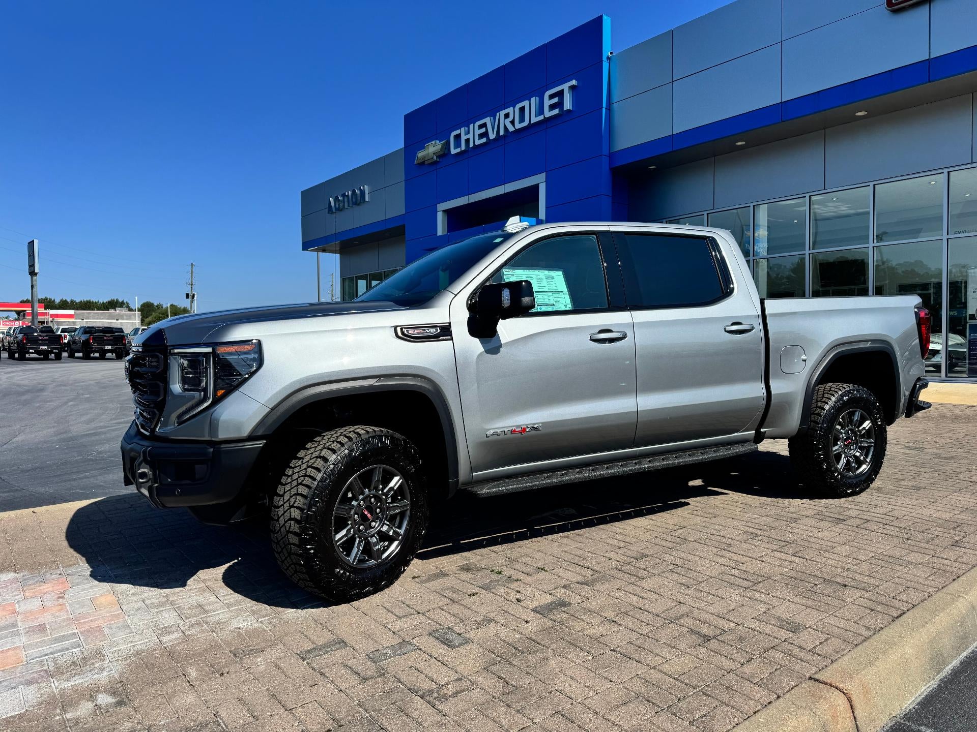 2026 GMC Sierra 1500 AT4X in Sterling Metallic — front three-quarter view